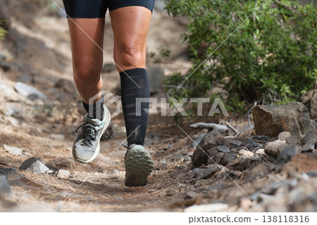 Walking or running exercise legs on rocky footpath in bright forest achievement fitness adventure and exercising in spring or summer nature motivation and inspirational activity Walking or running exercise legs on rocky footpath in bright forest achievement fitness adventure and exercising in spring or summer nature motivation and inspirational activity 138118316