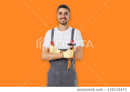 Occupation, Worker stands with tools and smiles in craft space 138118471