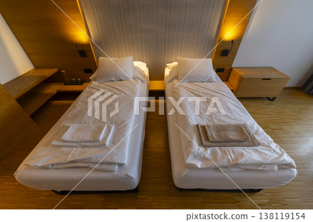 Modern hotel room with two single beds Modern hotel room with two single beds 138119154