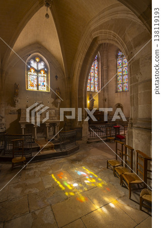 Church interior with colorful light from stained glass windows Church interior with colorful light from stained glass windows 138119193