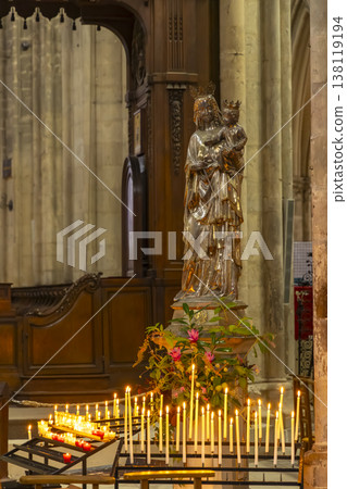 Virgin Mary and Child statue with burning candles in Bourges cathedral Virgin Mary and Child statue with burning candles in Bourges cathedral 138119194