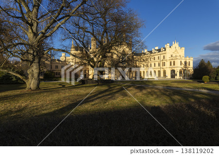 Lednice Palace facade and bare trees on sunny day Lednice Palace facade and bare trees on sunny day 138119202