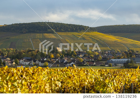 Chablis village surrounded by vibrant autumn vineyards in Bourgogne Chablis village surrounded by vibrant autumn vineyards in Bourgogne 138119236