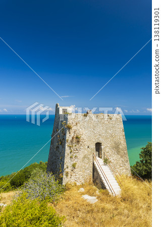 Old Peschici watchtower on Gargano coast overlooking sea Old Peschici watchtower on Gargano coast overlooking sea 138119301