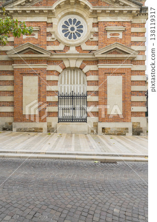 Epernay building facade with round window and old cobblestone street 138119317
