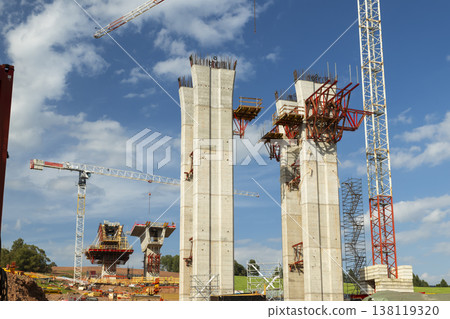 Building highway viaduct pillars with towering cranes in Czechia Building highway viaduct pillars with towering cranes in Czechia 138119320