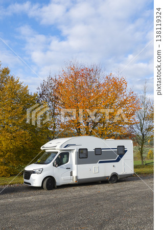 White motorhome parked on B36 road during autumn White motorhome parked on B36 road during autumn 138119324