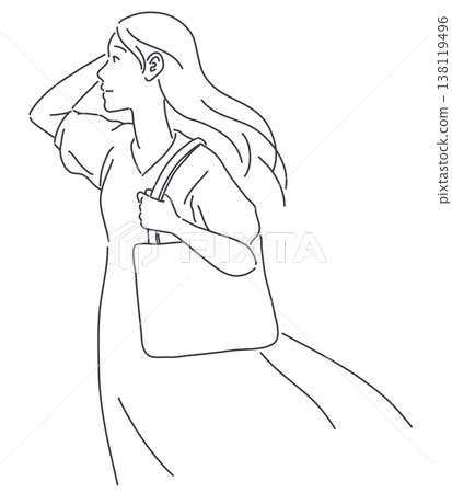 一個女人提著手提袋,只有一陣風吹過。 一個女人提著手提袋,只有一陣風吹過。 138119496