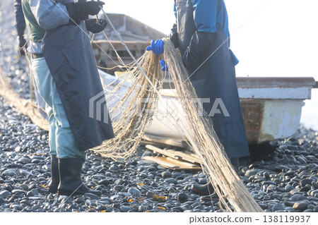Fisherman clearing his net Fisherman clearing his net 138119937