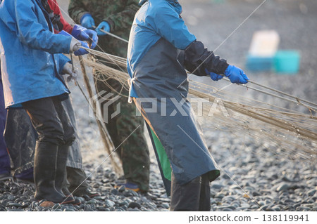 Fishermen pulling nets from the shore Fishermen pulling nets from the shore 138119941
