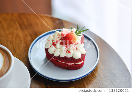 red velvet cake with strawberry topping or a piece of cake or small cake red velvet cake with strawberry topping or a piece of cake or small cake 138120061