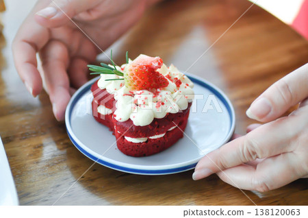 red velvet cake with strawberry topping or a piece of cake or small cake 138120063