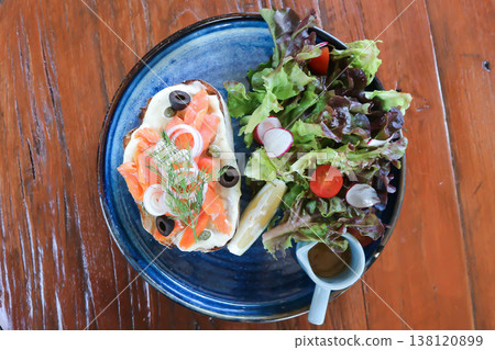 smoked salmon with bread and salad or salmon sandwich smoked salmon with bread and salad or salmon sandwich 138120899