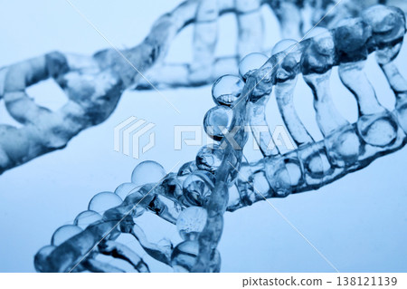 Abstract cosmetic lab. Dna double helix structure forming with clear liquid Abstract cosmetic lab. Dna double helix structure forming with clear liquid 138121139