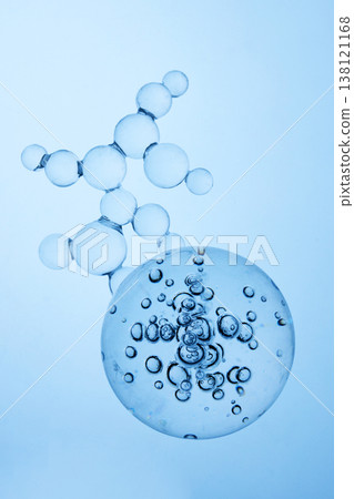Abstract cosmetic lab. Blue molecule structure and bubbles in clear liquid Abstract cosmetic lab. Blue molecule structure and bubbles in clear liquid 138121168