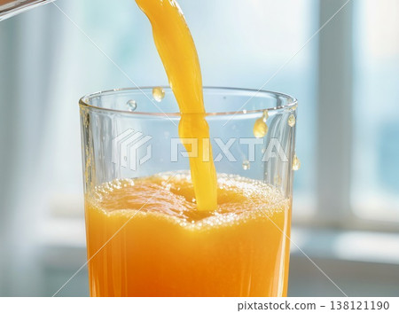 Pouring Freshly Squeezed Orange Juice into Glass Close-up Pouring Freshly Squeezed Orange Juice into Glass Close-up 138121190