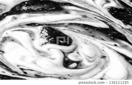 A marbled background with a mix of black and white. A marbled background with a mix of black and white. 138121285