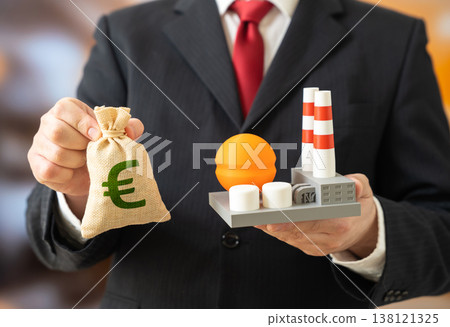 A businessman owns an industrial plant and has a euro in his pocket. Buying or selling a business. Investing in energy and the chemical industry. Industrial assets and capital flows shape production A businessman owns an industrial plant and has a euro in his pocket. Buying or selling a business. Investing in energy and the chemical industry. Industrial assets and capital flows shape production 138121325