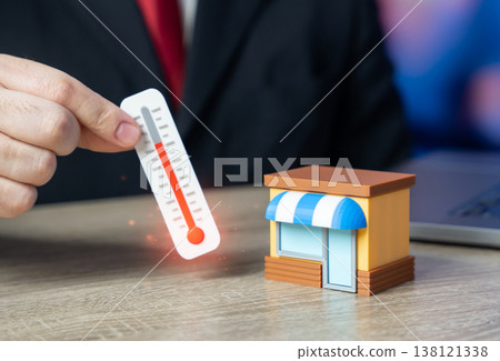 A man taking the temperature of a business. Investment climate and acceptable business conditions. Understanding store problems and optimizing business processes. Performance analysis A man taking the temperature of a business. Investment climate and acceptable business conditions. Understanding store problems and optimizing business processes. Performance analysis 138121338