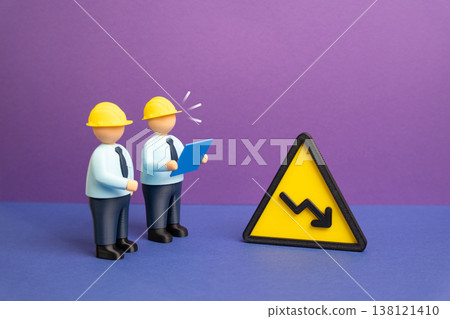 Engineers studying a performance decline. Declining performance, problems, and solutions. Technical analysis identifies issues. Optimization strategies improve efficiency and restore Engineers studying a performance decline. Declining performance, problems, and solutions. Technical analysis identifies issues. Optimization strategies improve efficiency and restore 138121410
