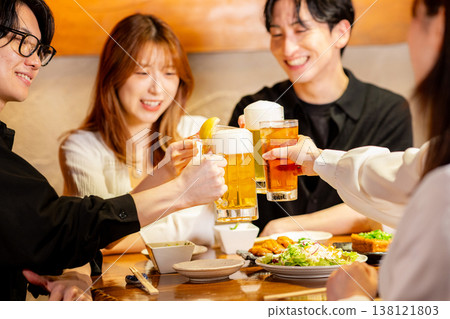 A man toasting in a pub 138121803