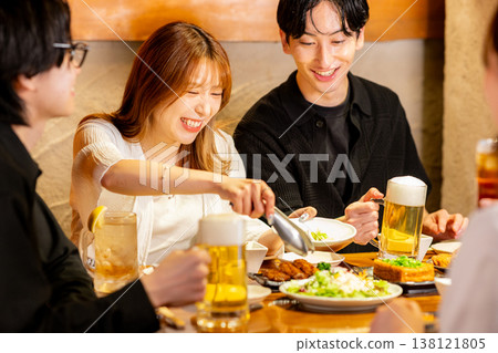 A man toasting in a pub 138121805