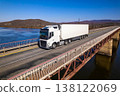 White truck on a bridge over the river 138122069