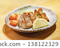 Grilled thick slices of juicy pork belly with lemon. 138122329