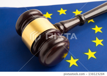 EU Legal, justice and agreement, wooden court gavel on flag. EU Legal, justice and agreement, wooden court gavel on flag. 138123284