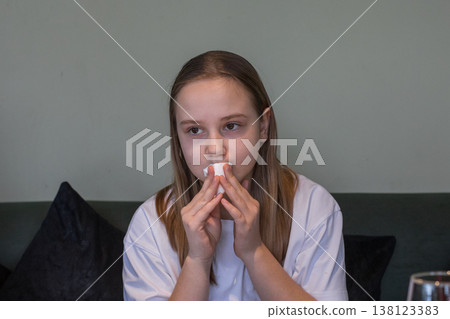 Cute child girl using paper napkin indoor 138123383