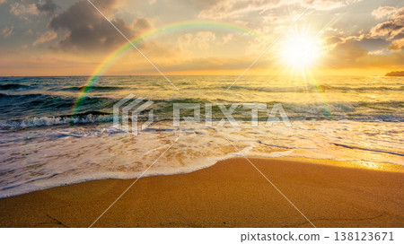 sunset over sandy sea beach background in autumn. low angle view. empty seascape scenery with calm waves. beauty seashore wallpaper. peaceful bay photo for advertising. weather with rainbow sunset over sandy sea beach background in autumn. low angle view. empty seascape scenery with calm waves. beauty seashore wallpaper. peaceful bay photo for advertising. weather with rainbow 138123671