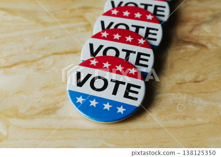 diagonal line of vote badges on marble 138125350