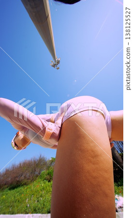 Bright outdoor setting showcasing woman in motion with lively energy Bright outdoor setting showcasing woman in motion with lively energy 138125527