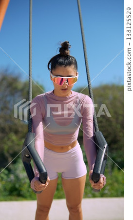 Summer outdoor training with rings and energetic fitness vibe Summer outdoor training with rings and energetic fitness vibe 138125529
