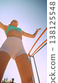 Female athlete exudes confidence during seaside workout session 138125548