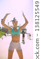 Caucasian dance instructor reaching upward in sunlight 138125549