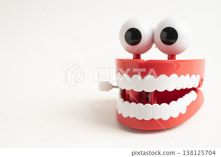 Funny red teeth with eye toy denture model for dental health care. Funny red teeth with eye toy denture model for dental health care. 138125704
