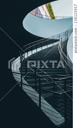 Modern curved staircase with metal railing in minimalist interior architecture, Contemporary concrete stairs with smooth lines and clean design in modern building 4k Modern curved staircase with metal railing in minimalist interior architecture, Contemporary concrete stairs with smooth lines and clean design in modern building 4k 138125917
