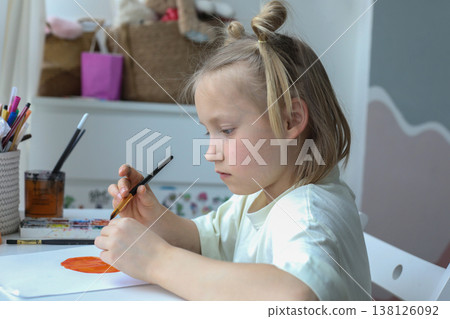Little child painting at home. Close-up portrait of little girl indoor Little child painting at home. Close-up portrait of little girl indoor 138126092