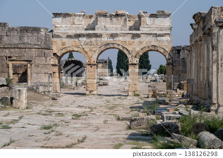 Exploring the Ancient Ruins of Pamukkale, Turkey, With Stunning Stone Arches and Historical Pathways Under a Clear Blue Sky Exploring the Ancient Ruins of Pamukkale, Turkey, With Stunning Stone Arches and Historical Pathways Under a Clear Blue Sky 138126298