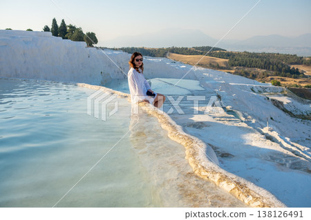 Discovering the Beauty of Pamukkales Thermal Pools During a Sunny Day While Relaxing by the Waters Discovering the Beauty of Pamukkales Thermal Pools During a Sunny Day While Relaxing by the Waters 138126491