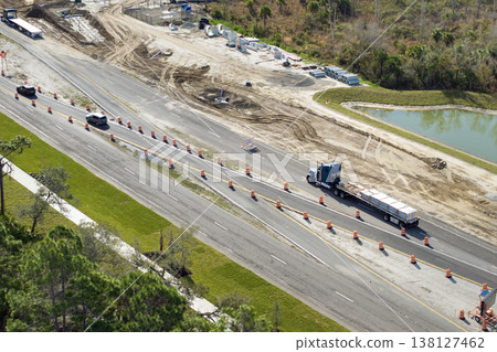 Industrial roadworks. Wide American highway under construction. Development of transportation system for rapid transit Industrial roadworks. Wide American highway under construction. Development of transportation system for rapid transit 138127462