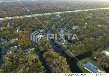 Heavy flood with high water surrounding residential houses after hurricane rainfall in Florida residential area. Consequences of natural disaster 138127493