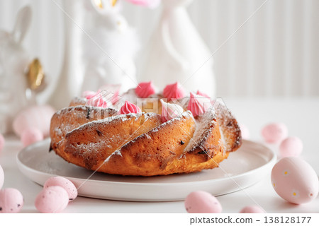 Traditional Easter cakes with icing decorated candies on white wooden table Traditional Easter cakes with icing decorated candies on white wooden table 138128177
