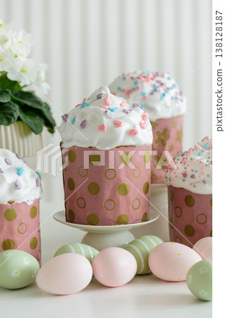 Easter Cupcakes with Eggs and Spring Decorations on White Background Easter Cupcakes with Eggs and Spring Decorations on White Background 138128187