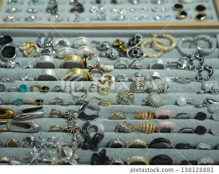 Neatly Arranged Ring Selection In Tray With Rows Of Bands And Gemstone Solitaires, Velvet Compartments, Inventoryready Layout For Retail And Wholesale, Catalog Photography Feel Neatly Arranged Ring Selection In Tray With Rows Of Bands And Gemstone Solitaires, Velvet Compartments, Inventoryready Layout For Retail And Wholesale, Catalog Photography Feel 138128881