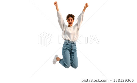 A joyful person doing a small jump with arms raised, smiling brightly. Isolated on white background. 138129366