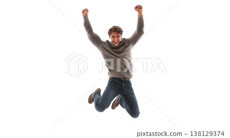 A joyful person doing a small jump with arms raised, smiling brightly. Isolated on white background. 138129374