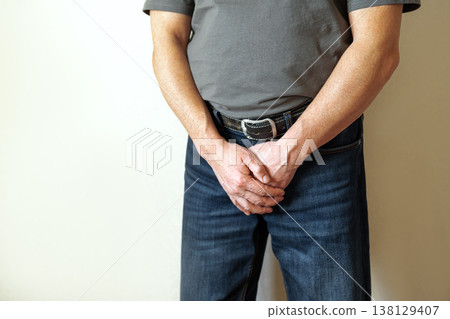 Senior man holding his crotch with prostate problems Senior man holding his crotch with prostate problems 138129407