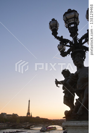 A view of the sunset and streetlights during magic hour from the Pont Alexandre III, Paris, March 18, 2026. A view of the sunset and streetlights during magic hour from the Pont Alexandre III, Paris, March 18, 2026. 138129468
